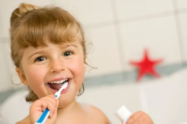 Child brushing teeth